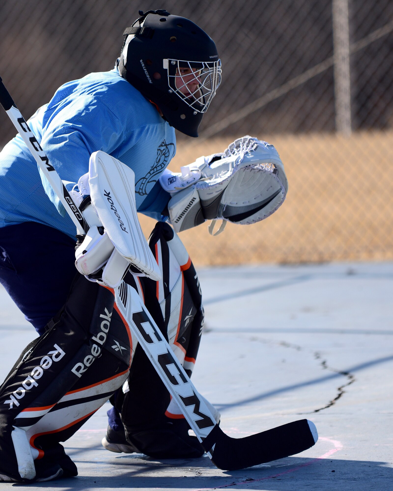 U.S. Air Force Staff Sgt. Aaron Bendel, the extramural hockey goalkeeper from the 509th Munitions Squadron, guards the goal during a practice session at Whiteman Air Force Base, Mo., Feb. 17, 2018. The hockey team was organized by members of the 509th MUNS to provide Team Whiteman with an opportunity to join a team closer to base. (U.S. Air Force photo by Staff Sgt. Danielle Quilla)