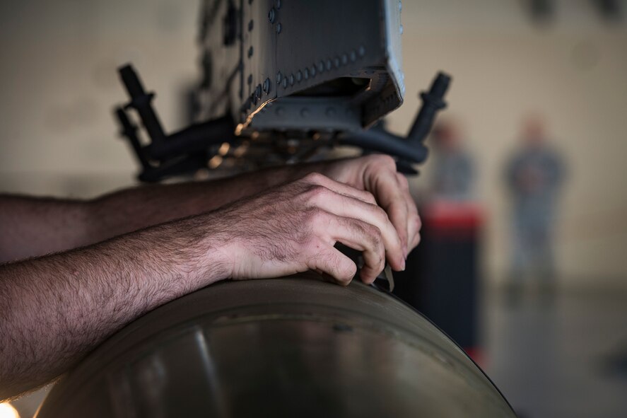 Staff Sgt. Kyle Davey, 75th Aircraft Maintenance Unit (AMU) weapons load crew chief, checks an umbilical on an inert MK-84 general purpose bomb during a weapons-load competition, Feb. 22, 2018, at Moody Air Force Base, Ga. Judges assessed the 75th and 74th AMUs on how quickly and efficiently they loaded munitions onto an A-10C Thunderbolt II during the loading portion of the competition. They were also judged on dress and appearance and a written test based on munition knowledge. (U.S. Air Force photo by Senior Airman Janiqua P. Robinson)