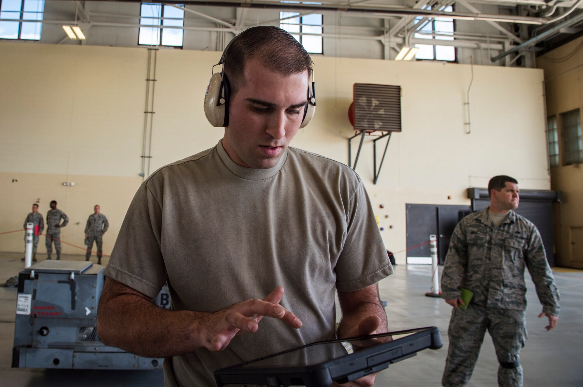 Staff Sgt. Kyle Davey, 75th Aircraft Maintenance Unit (AMU) weapons load crew chief, checks a technical order during a weapons-load competition, Feb. 22, 2018, at Moody Air Force Base, Ga. Judges assessed the 75th and 74th AMUs on how quickly and efficiently they loaded munitions onto an A-10C Thunderbolt II during the loading portion of the competition. They were also judged on dress and appearance and a written test based on munition knowledge. (U.S. Air Force photo by  Senior Airman Janiqua P. Robinson)