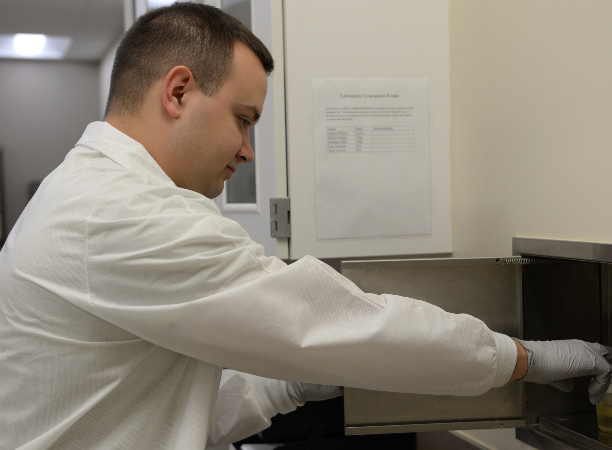 Staff Sgt. Jonathan Hall, 14th Medical Support Squadron NCO in charge of laboratory shipping, receives a urine sample Feb. 20, 2018, on Columbus Air Force Base, Mississippi. Blood and urine tests are common for the laboratory on Columbus AFB, providing doctors with the information they need to diagnose patients for a range of diseases and conditions. (U.S. Air Force photo by Airman 1st Class Keith Holcomb)