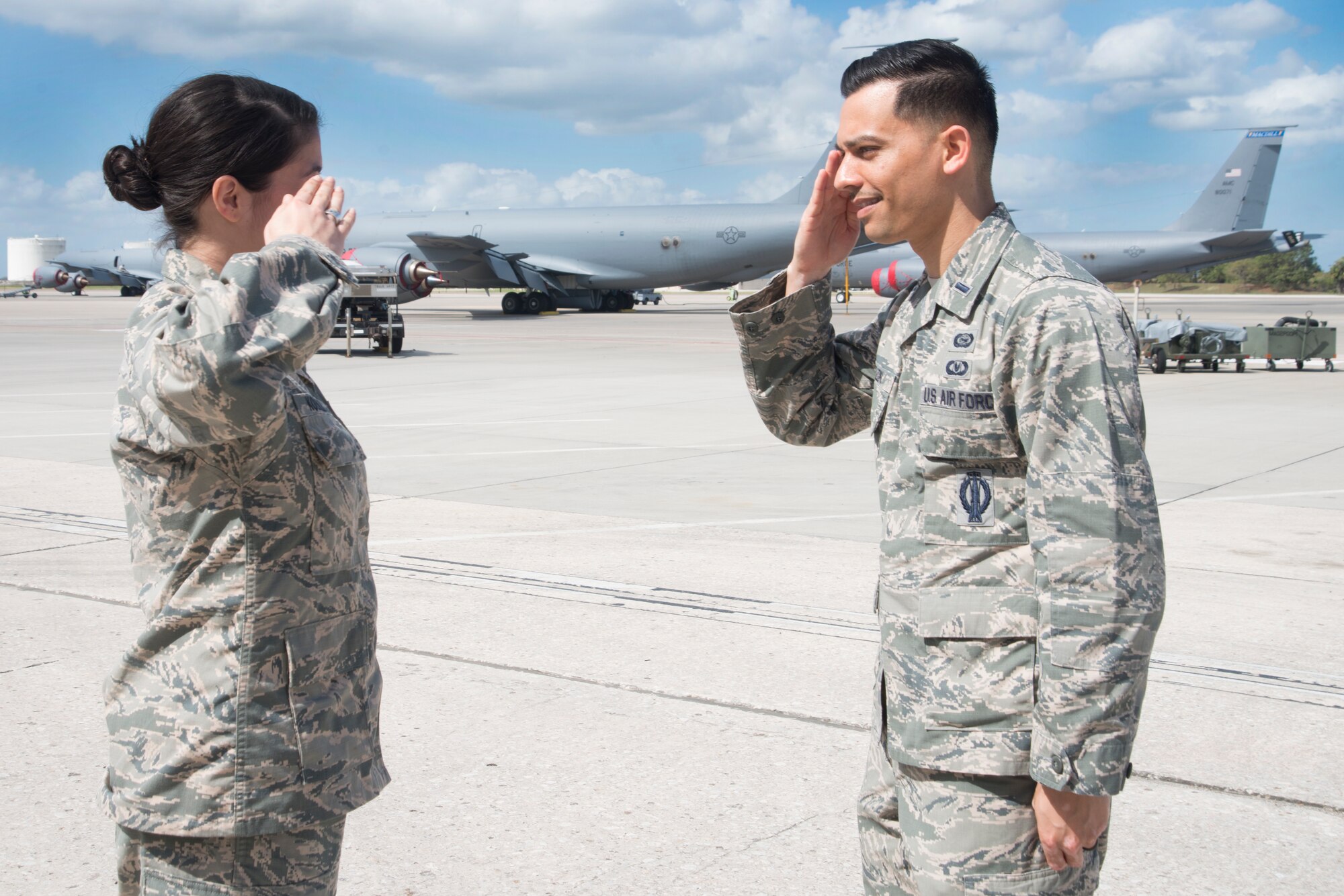 U.S. Air Force 1st Lt. David Deleon, right, an intelligence officer assigned to the 6th Operations Support Squadron (OSS), salutes Olivia Koehler, left, a student in her junior year at the University of South Florida (USF), at MacDill Air Force Base, Fla., Feb. 21, 2018.