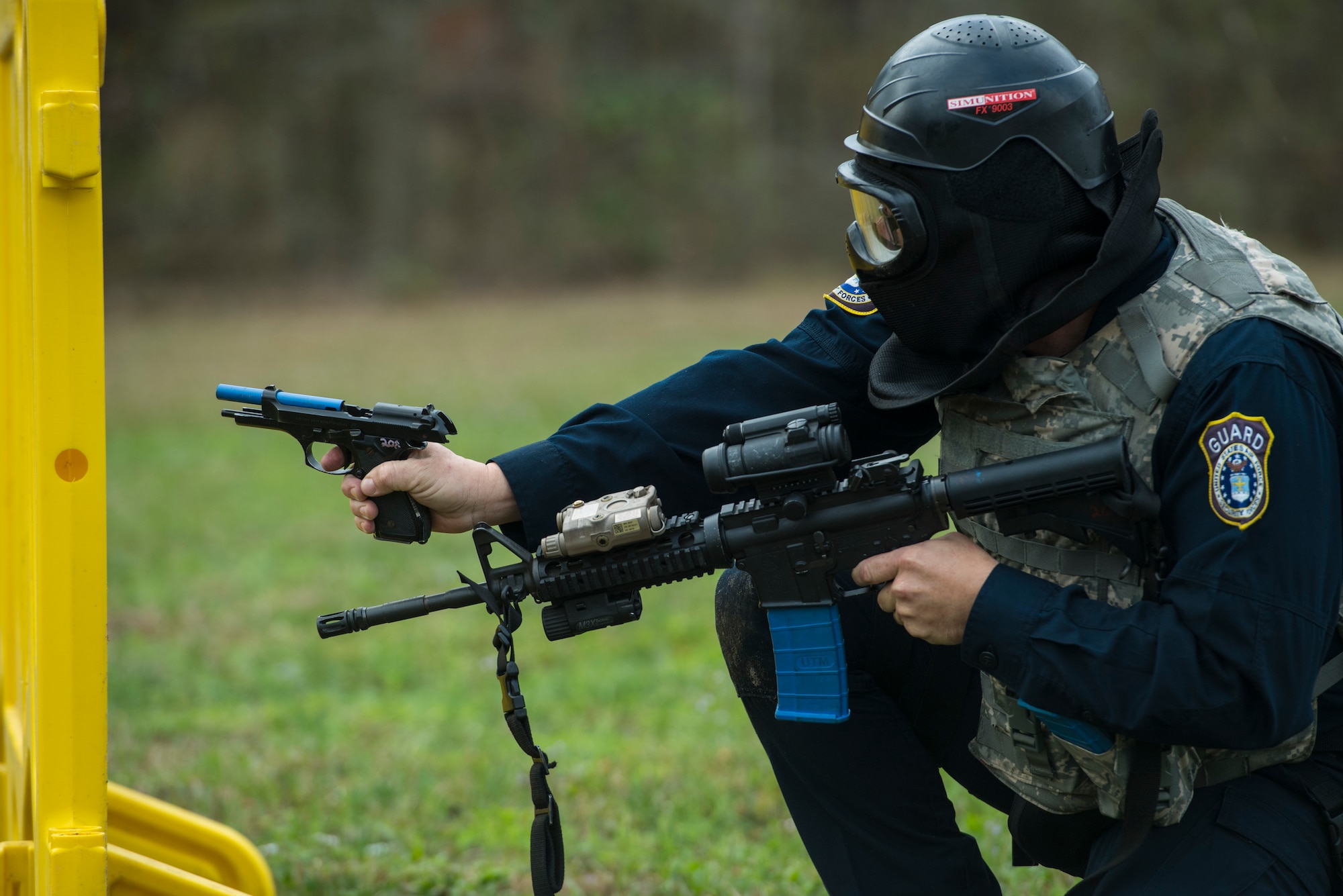 A contractor from the 23d Security Forces Squadron empties a clip during a training event, Feb. 22, 2018, at Moody Air Force Base, Ga. “Shoot, move, communicate” is a training event that tests participants on their ability to move from barricade to barricade as a team. While one member provided covering fire the others advanced on the enemy, then retreated from the scenario while they maintained cover fire. Security Forces members would employ these tactics anytime they’re under enemy fire. (U.S. Air Force photo by Senior Airman Janiqua P. Robinson)