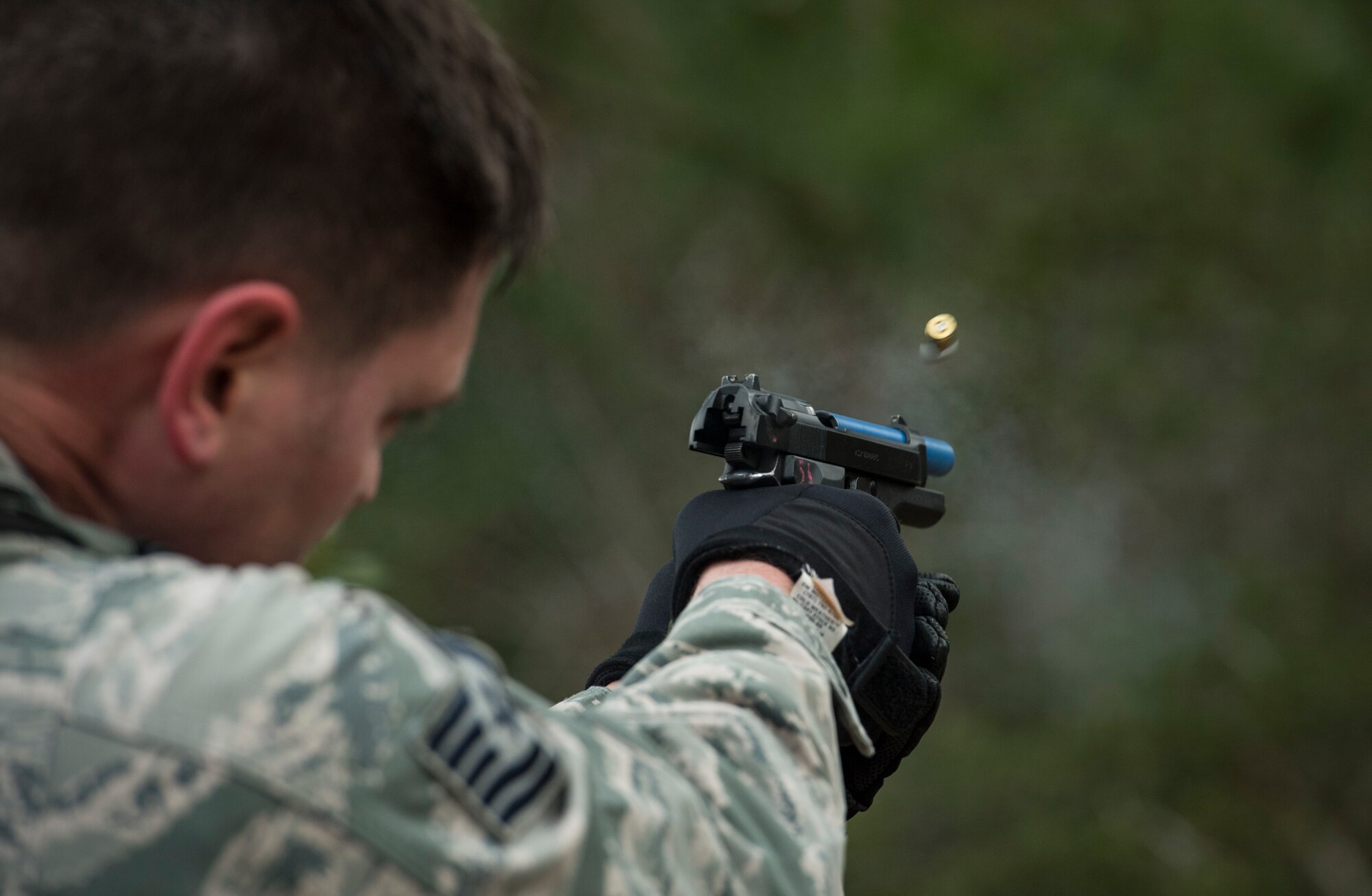 Tech. Sgt. Stephen O’hara, 23d Security Forces Squadron flight chief, expends extra rounds from an M9 Beretta pistol after a training event, Feb. 22, 2018, at Moody Air Force Base, Ga. “Shoot, move, communicate” is a training event that tests participants on their ability to move from barricade to barricade as a team. While one member provided covering fire the others advanced on the enemy, then retreated from the scenario while they maintained cover fire. Security Forces members would employ these tactics anytime they’re under enemy fire. (U.S. Air Force photo by Senior Airman Janiqua P. Robinson)