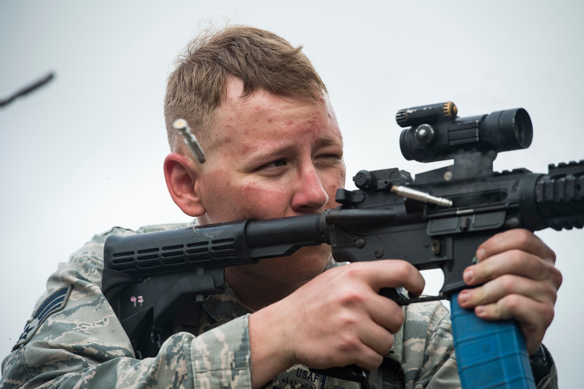 Senior Airman Adam Irwin, 23d Security Forces Squadron installation patrolman, expends extra rounds from an M4 carbine after a training event, Feb. 22, 2018, at Moody Air Force Base, Ga. “Shoot, move, communicate” is a training event that tests participants on their ability to move from barricade to barricade as a team. While one member provided covering fire the others advanced on the enemy, then retreated from the scenario while they maintained cover fire. Security Forces members would employ these tactics anytime they’re under enemy fire. (U.S. Air Force photo by Senior Airman Janiqua P. Robinson)