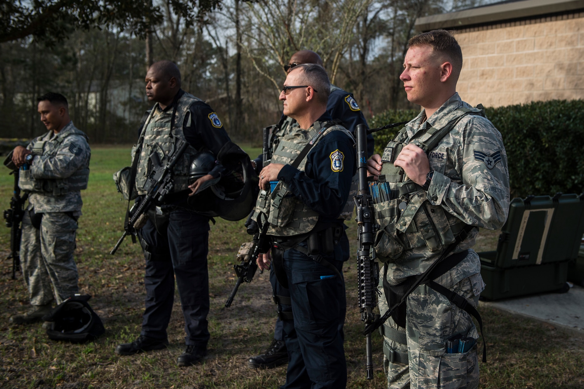 Personnel from the 23d Security Forces Squadron listen to a brief before participating in a training event, Feb. 22, 2018, at Moody Air Force Base, Ga. “Shoot, move, communicate” is a training event that tests participants on their ability to move from barricade to barricade as a team. While one member provided covering fire the others advanced on the enemy, then retreated from the scenario while they maintained cover fire. Security Forces members would employ these tactics anytime they’re under enemy fire. (U.S. Air Force photo by Senior Airman Janiqua P. Robinson)