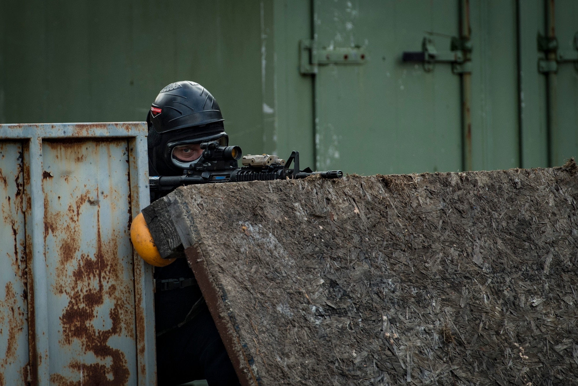 John Kramer, 23d Security Forces Squadron entry controller, scans his perimeter during a training event, Feb. 22, 2018, at Moody Air Force Base, Ga. “Shoot, move, communicate” is a training event that tests participants on their ability to move from barricade to barricade as a team. While one member provided covering fire the others advanced on the enemy, then retreated from the scenario while they maintained cover fire. Security Forces members would employ these tactics anytime they’re under enemy fire. (U.S. Air Force photo by  Senior Airman Janiqua P. Robinson)