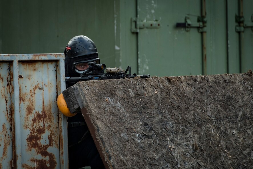 John Kramer, 23d Security Forces Squadron entry controller, scans his perimeter during a training event, Feb. 22, 2018, at Moody Air Force Base, Ga. “Shoot, move, communicate” is a training event that tests participants on their ability to move from barricade to barricade as a team. While one member provided covering fire the others advanced on the enemy, then retreated from the scenario while they maintained cover fire. Security Forces members would employ these tactics anytime they’re under enemy fire. (U.S. Air Force photo by  Senior Airman Janiqua P. Robinson)
