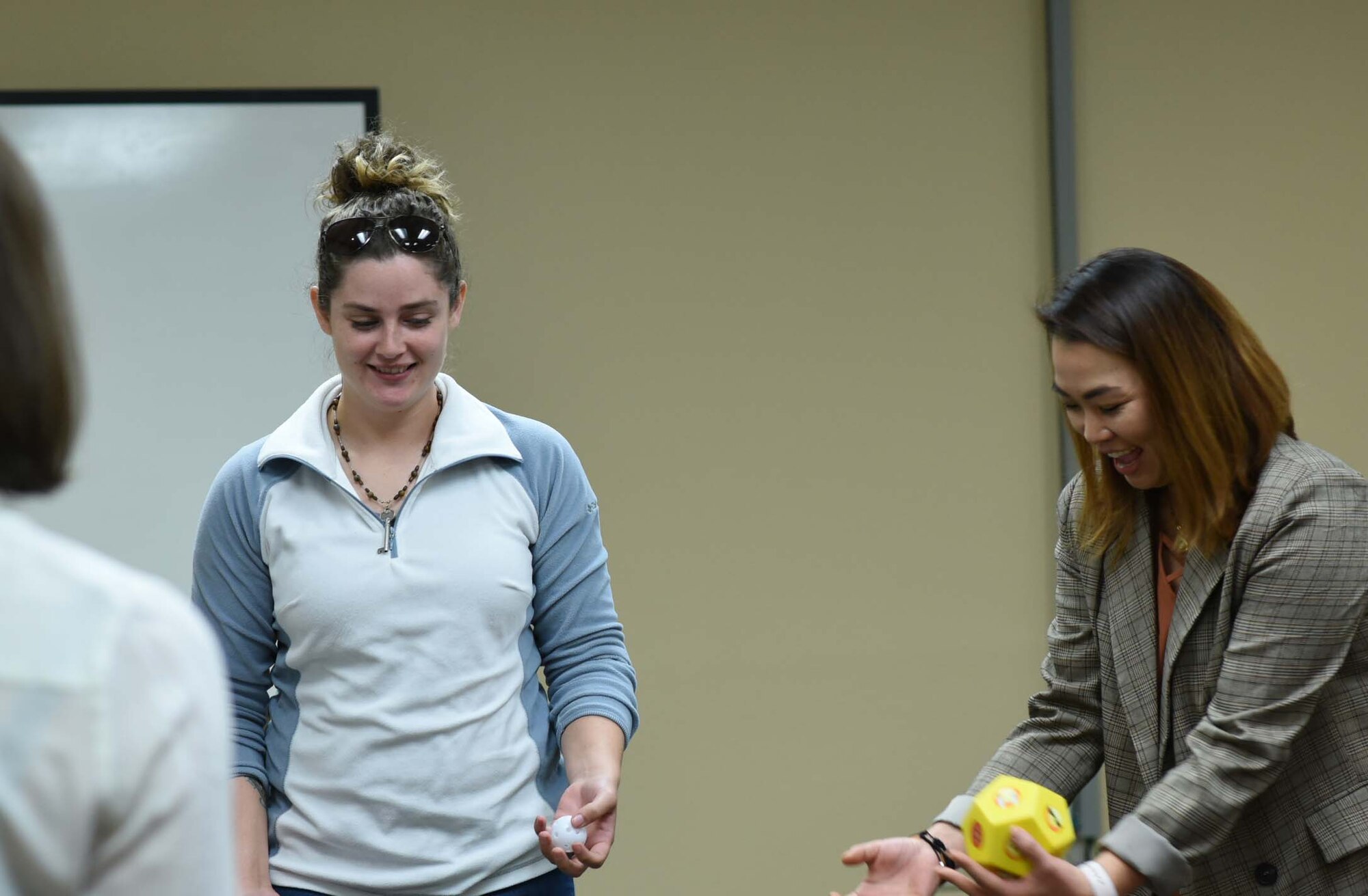 Spouses play a game during a Heartlink event for active duty spouses Feb. 15, 2018 at the Lone Star Center on Naval Air Station Fort Worth Joint Reserve Base, Texas. Spouses whose Airman are assigned to the 355th Fighter Squadron, an active associate component of the 301st Fighter Wing, attended the event to learn about local resources available to them and their families. (U.S. Air Force photos by Melissa Harvey)