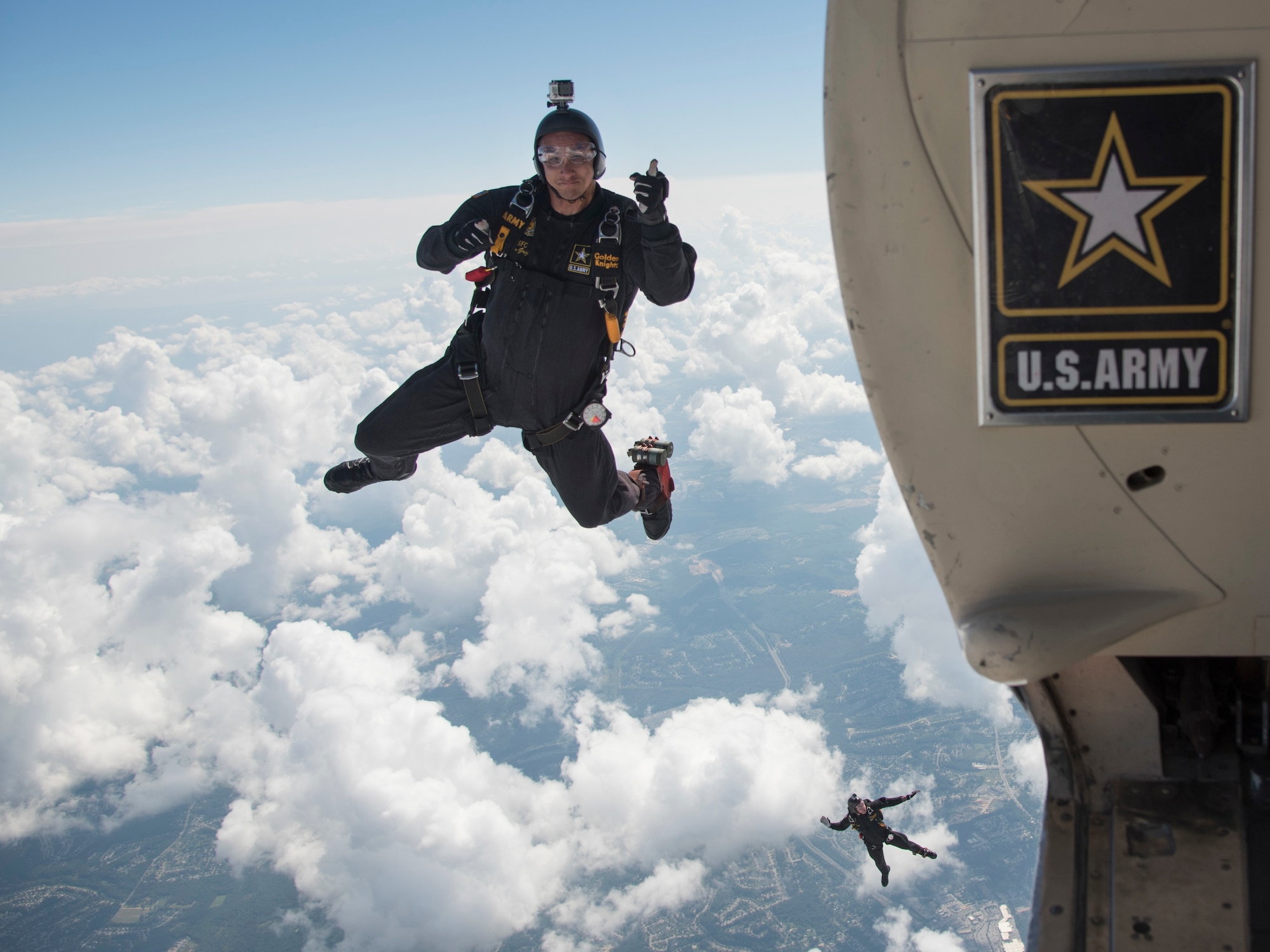 U.S. Army Parachute Team “Golden Knights” members jump out of a C-31 Fokker during the 2017 Joint Base Andrews Air Show: America’s Air & Space Expo at JBA, Md., Sept. 17, 2017. The three-day event was in conjunction with the Air Force’s 70th anniversary and displayed it capabilities through air power and focused on Science, Technology, Engineering and Math. (U.S. Air Force photo by Airman 1st Class Valentina Lopez)