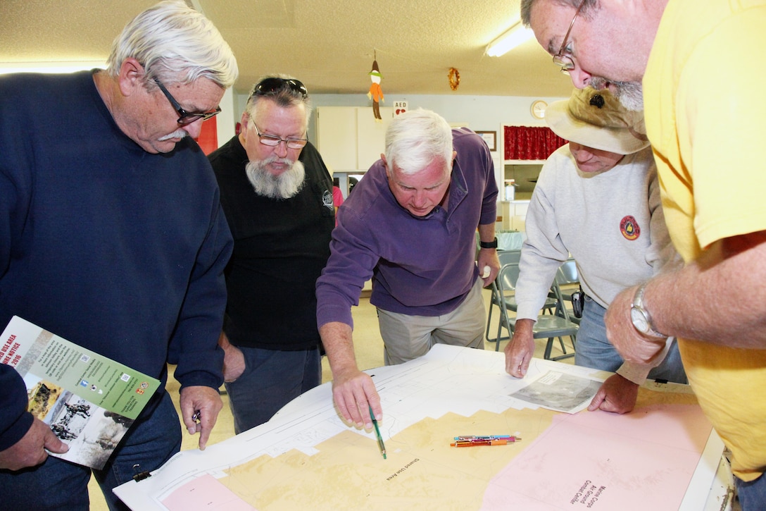 Marine Corps Air Ground Combat Center officials meet with local residents during a planning meeting.