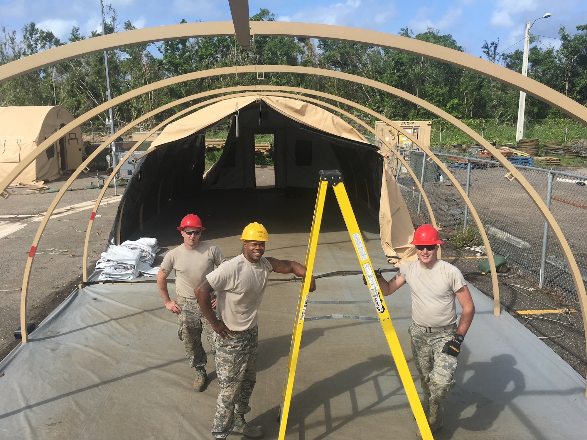 Civil Engineers from the 102nd Intelligence Wing, Otis Air National Guard Base, Cape Cod, Massachusetts, work at Camp Tortuguero, Vega Baja, Puerto Rico in December 2017. The National Guard was mobilized to provide disaster relief in the aftermath of Hurricane Maria.