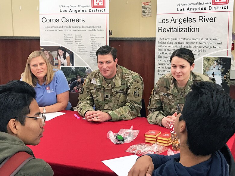 From left to right, Capt. David Watts, retired LA District employee Jody Fischer and 1st Lt. Kerry Horan, all with the U.S. Army Corps of Engineers Los Angeles District, answer questions from high school students about their careers during the  Engineering and Environmental Science Academy Career Exploration Showcase Feb. 14 at John Muir High School in Pasadena, California.