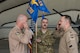 Col. William Marshall, commander of the 332d Expeditionary Operations Group, returns a salute to Maj. Robert McGowan after transferring command of the 361st Expeditionary Attack Squadron February 22, 2018, in Southwest Asia.  McGowan takes over command of the squadron from Lt. Douglas Olson. (U.S. Air Force photo by Staff Sgt. Joshua Kleinholz)