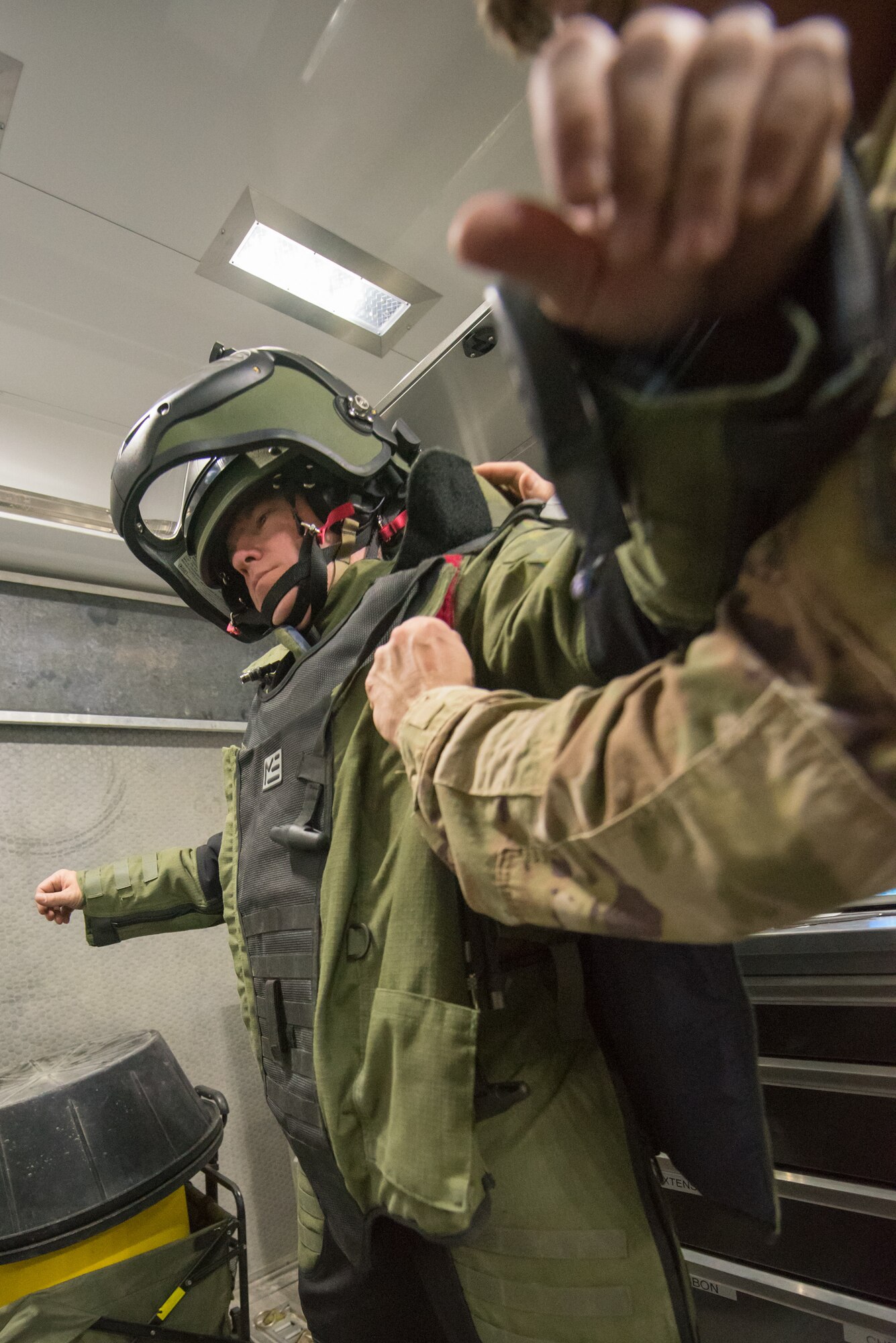 Tech Sgt. John Nelson, an explosive ordnance disposal team leader from the 379th Expeditionary Civil Engineer Squadron, is outfitted with an EOD 10 bomb suit during a training scenario at Al Udeid Air Base, Qatar, Feb. 15, 2018. The exercise, a collaborative effort between security forces and the explosive ordnance disposal flight, simulated a vehicle borne improvised explosive device threat. (U.S. Air Force photo by Staff Sgt. Joshua Horton)
