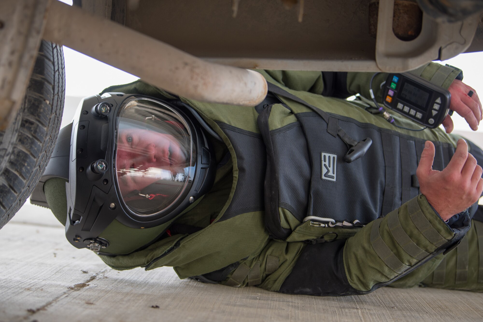 Tech Sgt. John Nelson, an explosive ordnance disposal team leader from the 379th Expeditionary Civil Engineer Squadron, searches a vehicle while wearing an EOD 10 bomb suit during a training scenario at Al Udeid Air Base, Qatar, Feb. 15, 2018. The exercise, a collaborative effort between security forces and the explosive ordnance disposal flight, simulated a vehicle borne improvised explosive device threat. (U.S. Air Force photo by Staff Sgt. Joshua Horton)