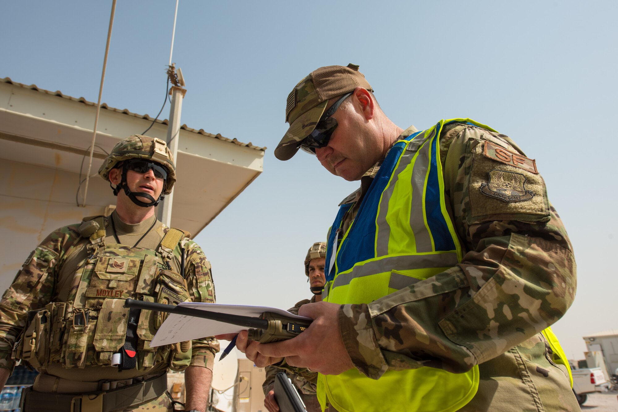 Members of the 379th Expeditionary Security Forces Squadron are inspected during a training scenario at Al Udeid Air Base, Qatar, Feb. 15, 2018. The exercise, a collaborative effort between security forces and the explosive ordnance disposal flight, simulated a vehicle borne improvised explosive device threat. (U.S. Air Force photo by Staff Sgt. Joshua Horton)