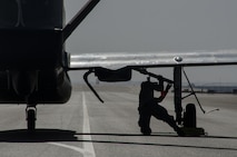 U.S. Air Force Senior Airman Dakota McAfee assigned to the 99th Expeditionary Reconnaissance Squadron, RQ-4 avionics technician, recovers an RQ-4 Global Hawk Feb. 13, 2018 at Al Dhafra Air Base, United Arab Emirates. The Global Hawk has been deployed operationally to support overseas contingency operations since November 2001. (U.S. Air National Guard photo by Staff Sgt. Colton Elliott)