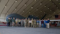 The 99th Expeditionary Reconnaissance Squadron celebrates being the first RQ-4 Global Hawk to log 20,000 flight hours Feb. 13, 2018 at Al Dhafra Air Base, United Arab Emirates. The Global Hawk is operated by the 12th Reconnaissance Squadron at Beale Air Force Base, California, and the 348th Reconnaissance Squadron at Grand Forks AFB, North Dakota, but aircraft are rotated to operational detachments worldwide. (U.S. Air National Guard photo by Staff Sgt. Colton Elliott)