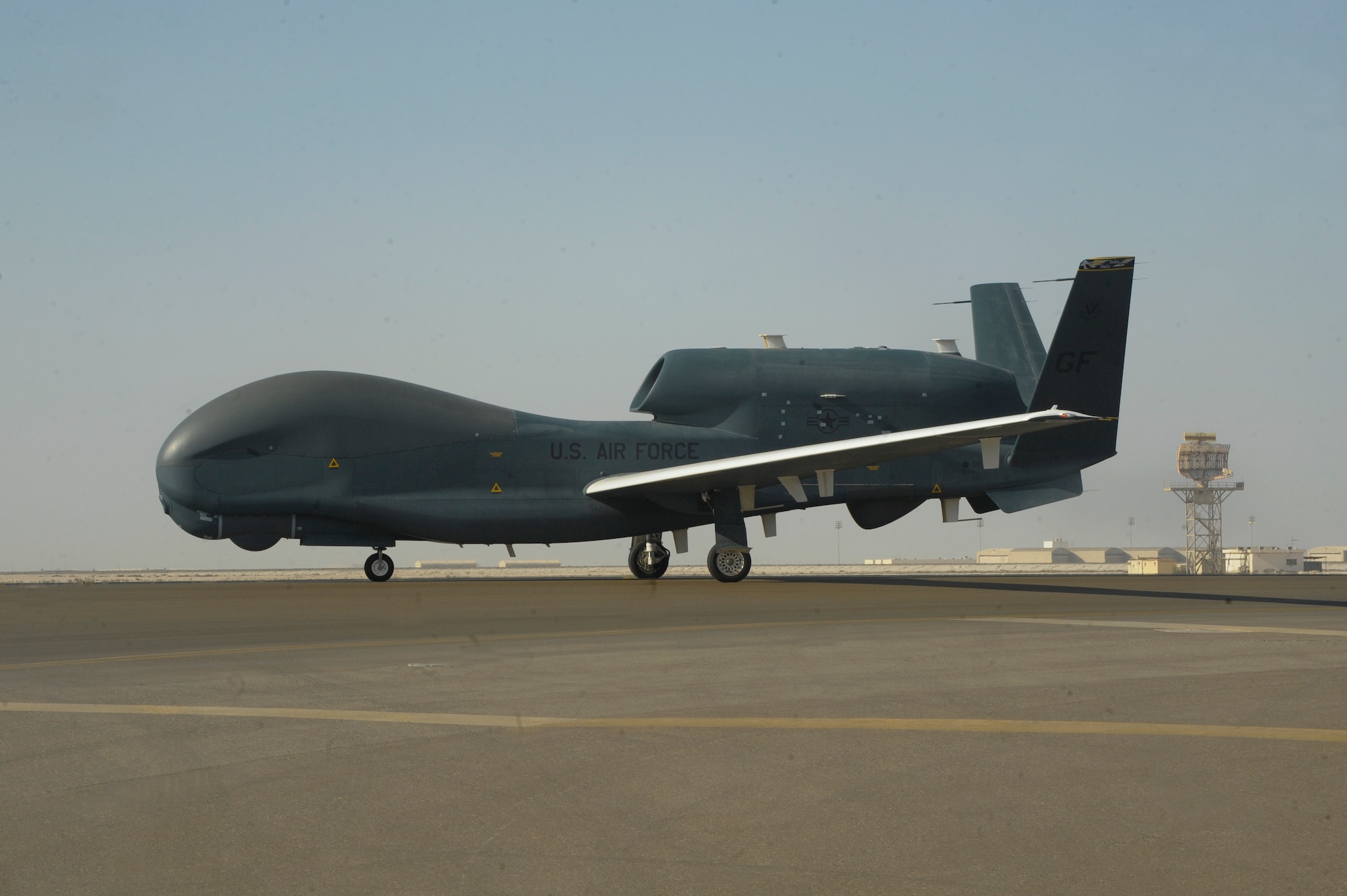 An U.S. Air Force RQ-4 Global Hawk logs over 20,000 flight hours Feb. 13, 2018 at Al Dhafra Air Base, United Arab Emirates. The Global Hawk's mission is to provide a broad spectrum of ISR collection capability to support joint combatant forces in worldwide peacetime, contingency and wartime operations. (U.S. Air Force photo by Airman 1st Class D. Blake Browning)