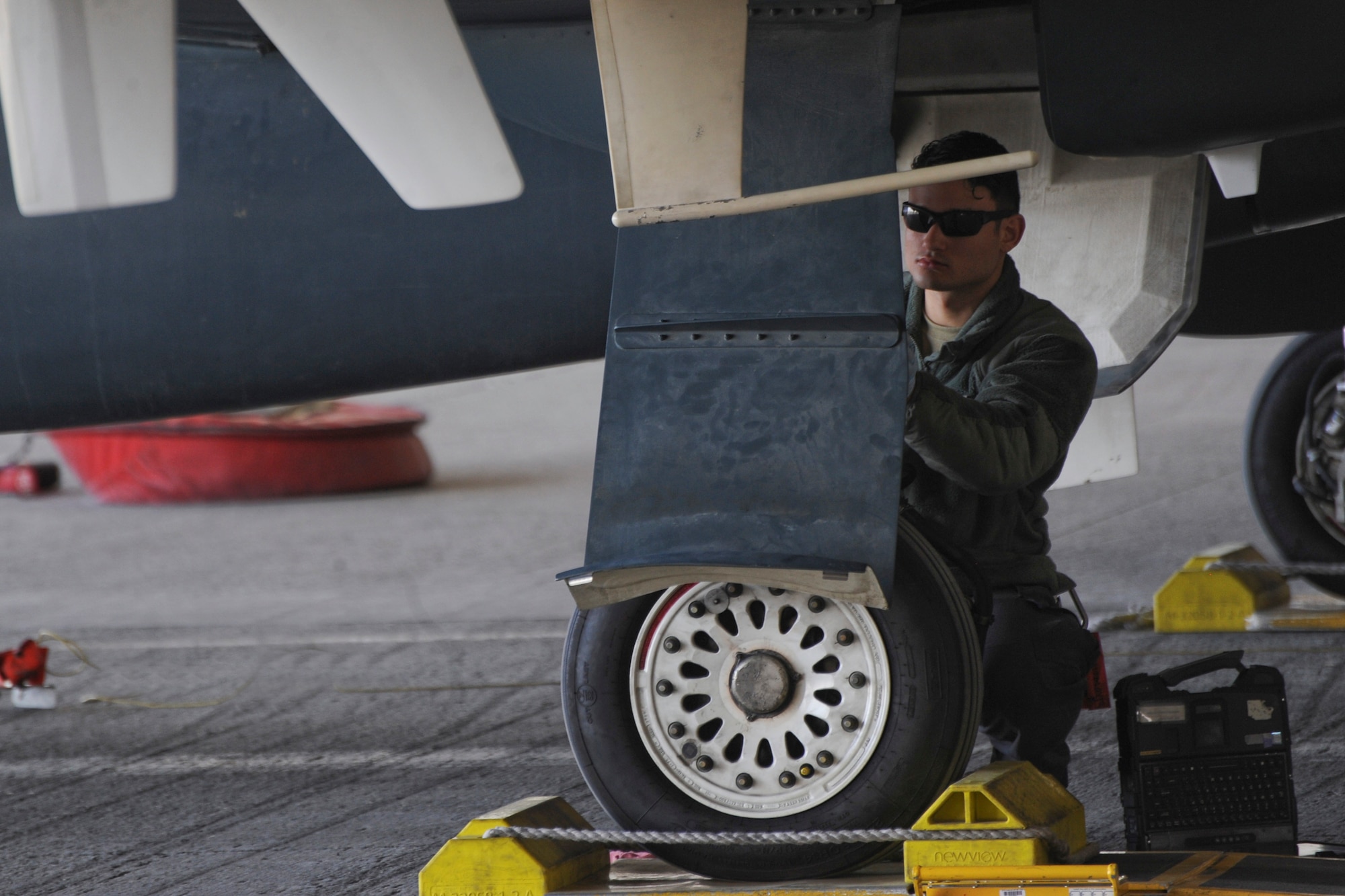 U.S. Air Force Airman 1st Class Christian De Jesus Roman, 380th Expeditionary Aircraft Maintenance Squadron crew chief, conducts post and preflight inspections on an RQ-4 Global Hawk Feb. 13, 2018 on Al Dhafra Air Base. The Global Hawk provides persistent near-real-time coverage using imagery intelligence (IMINT), signals intelligence (SIGINT) and moving target indicator (MTI) sensors. (U.S. Air Force photo by Airman 1st Class D. Blake Browning)