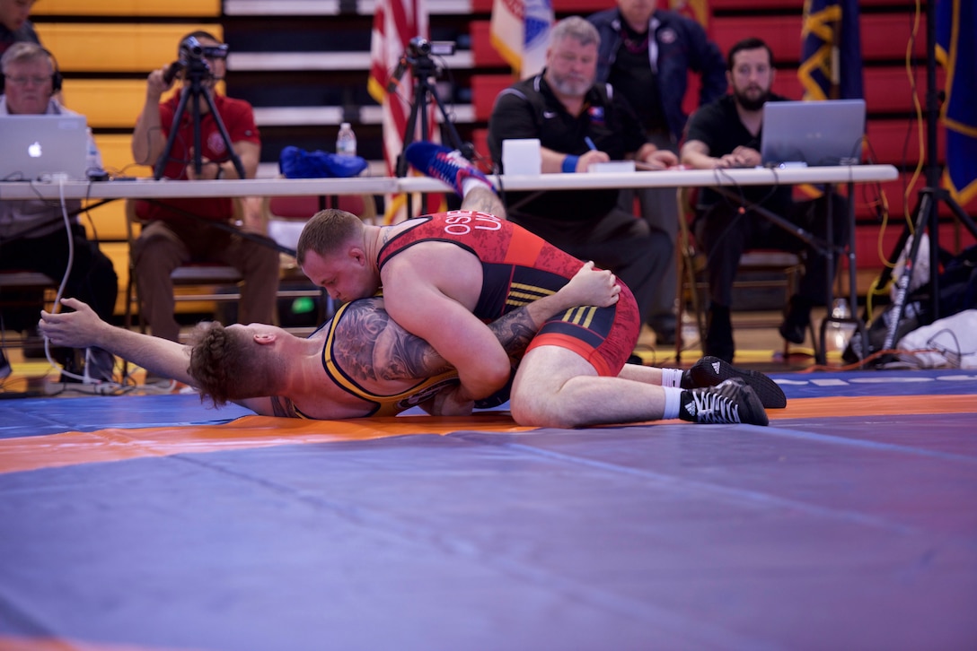 Sgt. Trent Osnes (U.S. Marines) pins PO3 Logan Renas (U.S. Navy) in 29 seconds at 130 kg, Photo by Petty Officer 1st Class Gulianna Dunn, U.S. Navy