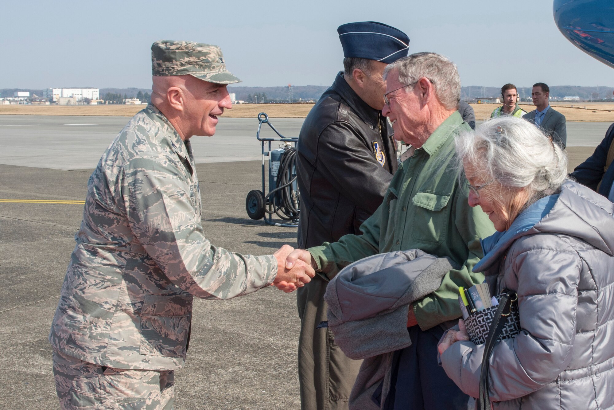 Col. Kenneth E. Moss, 374th Airlift Wing commander, shakes hands with Sen. James Inhofe, R-O.K., at Yokota Air Base, Japan, Feb. 24, 2018.