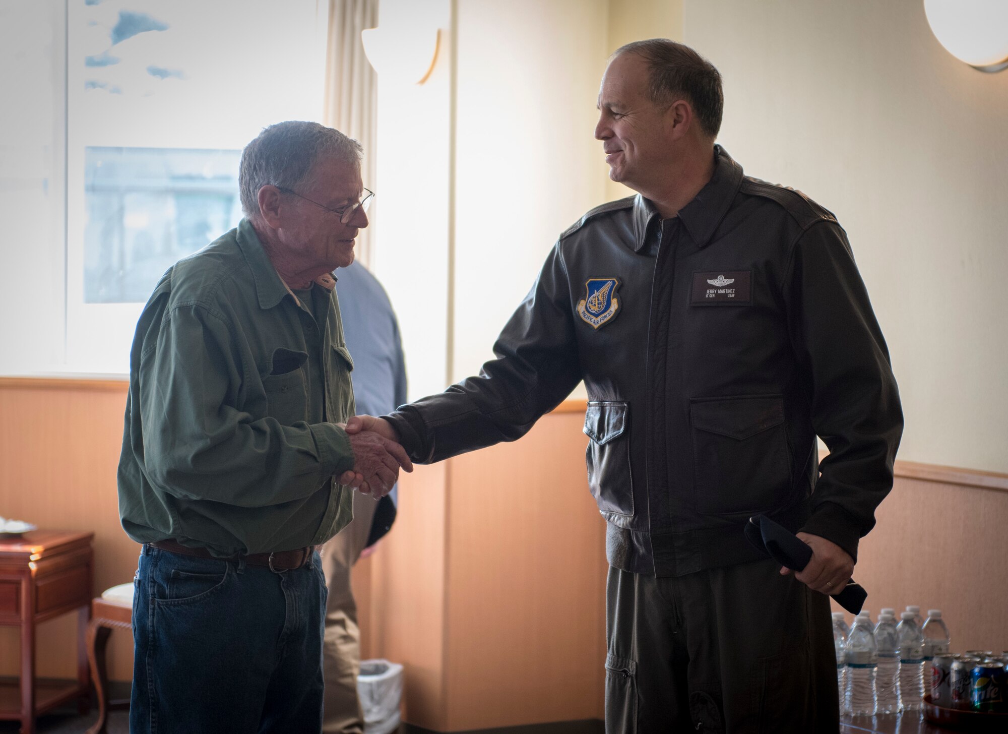 Lt. Gen. Jerry P. Martinez, United States Forces Japan and 5th Air Force commander, shakes hands with Sen. James Inhofe, R-O.K., to Yokota Air Base, Japan, Feb. 24, 2018.
