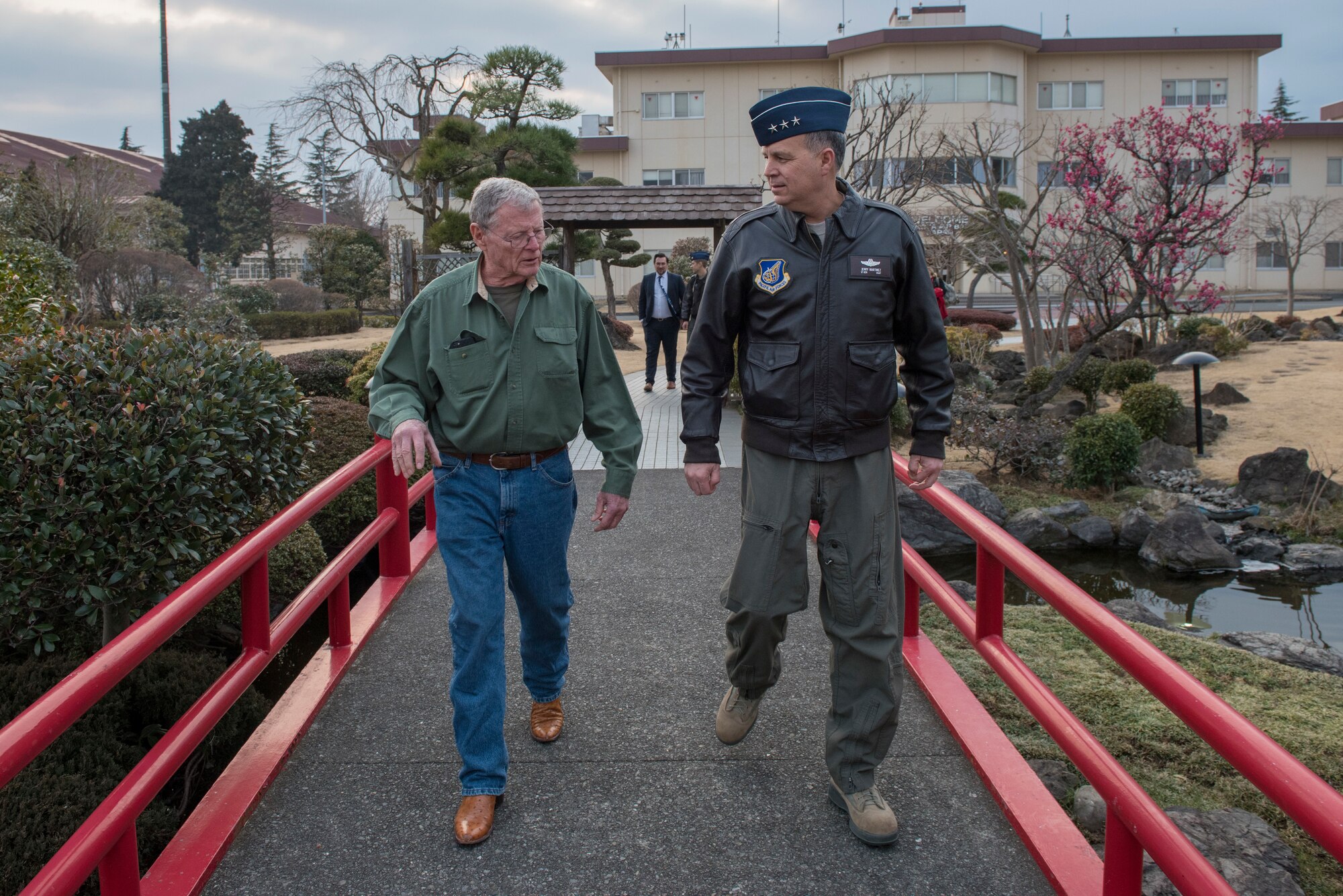 Lt. Gen. Jerry Martinez, United States Forces Japan and 5th Air Force commander, walks with Sen. James Inhofe, R-O.K., a senior member of the Senate Armed Services Committee, at Yokota Air Base, Japan, Feb. 25, 2018.