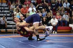 Daniel Miller of the U.S. Marine Corps tosses Raul Veliz of U.S. Air Force on the way to a technical fall at 97 kg on Sunday. Photo by Petty Officer 1st Class Gulianna Dunn of the U.S. Navy.