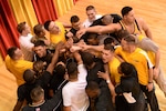 The U.S. Army team celebrates its Armed Forces freestyle title. Photo by Lt. Joe Painter, U.S. Navy