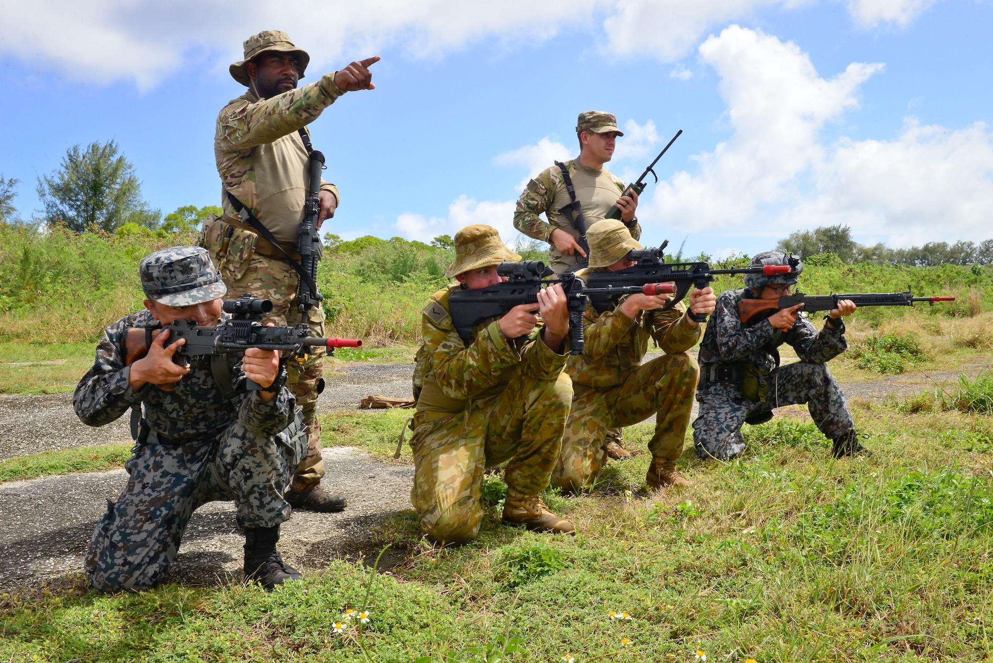 U.S. Air Force (USAF), Koku Jieitai (Japan Air Self-Defense) and Royal Australian Air Force (RAAF) members defend a perimeter during a training scenario in exercise COPE NORTH 18 at Tinian, U.S. Commonwealth of the Northern Marianas Islands, Feb. 20. Through exercises and engagements during COPE NORTH, USAF, Koku Jieitai and RAAF increase interoperability for humanitarian assistance/disaster relief operations. (U.S. Air Force photo by Airman 1st Class Christopher Quail)