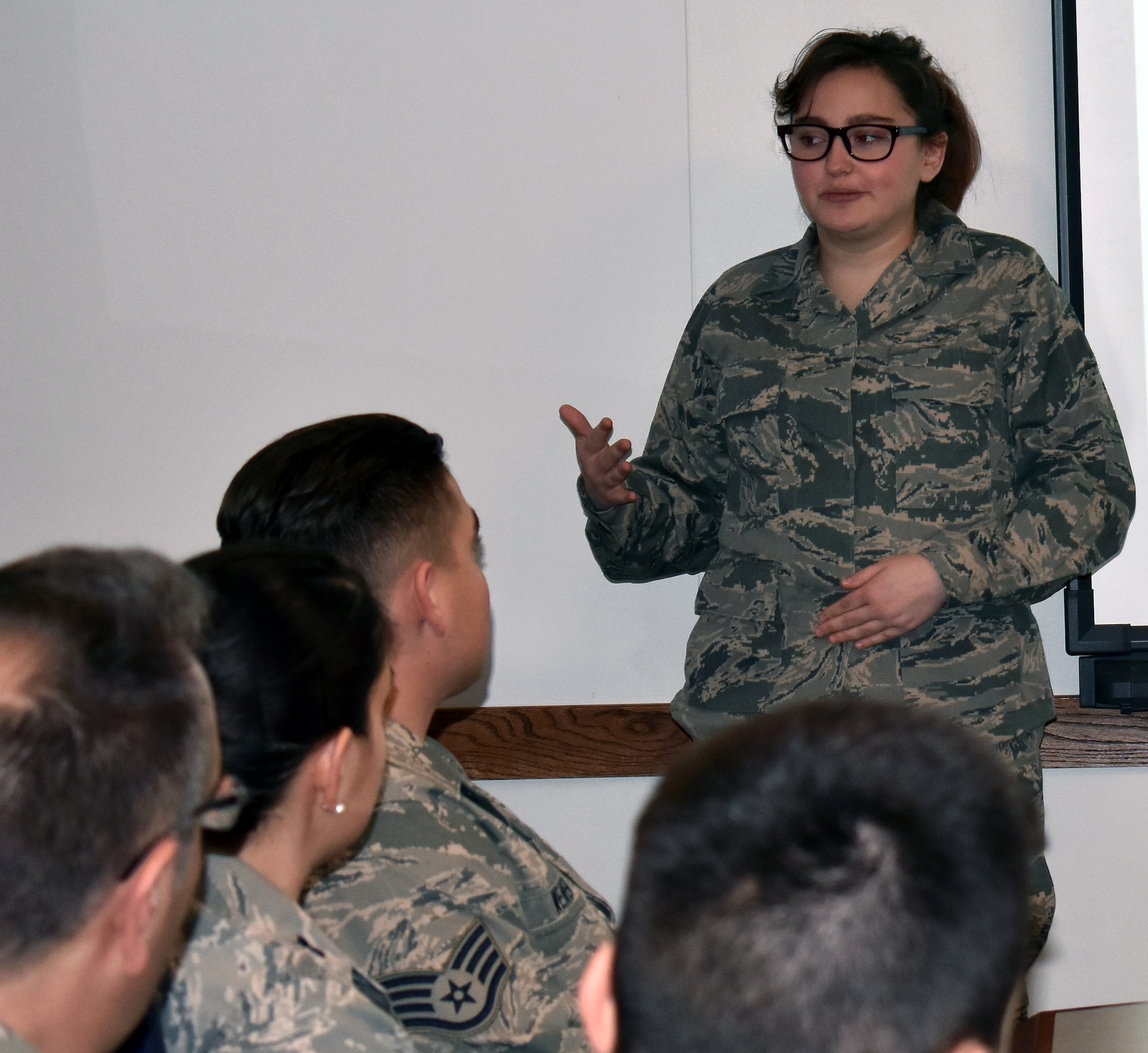 The 71st Intelligence Squadron’s honorary member, Tori, speaks to members of the unit during the Jan. 21, 2018 unit training assembly.