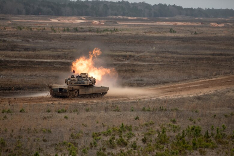 An M1A1 Abrams tank with 2nd Tank Battalion, 2nd Marine Division engages a target during semi-annual qualifications as part of a deployment for training exercise at Fort Stewart, Ga., Feb. 13, 2018. The DFT provides the opportunity to overcome home station range limitations as well as exercise the battalion’s capability to deploy equipment and personnel.