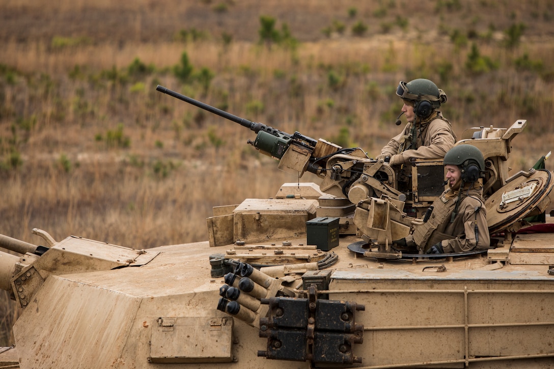 Marines with 2nd Tank Battalion, 2nd Marine Division await orders to commence semi-annual qualifications as part of a deployment for training exercise at Fort Stewart, Ga., Feb. 13, 2018. The DFT provides the opportunity to overcome home station range limitations as well as exercise the battalion’s capability to deploy equipment and personnel.