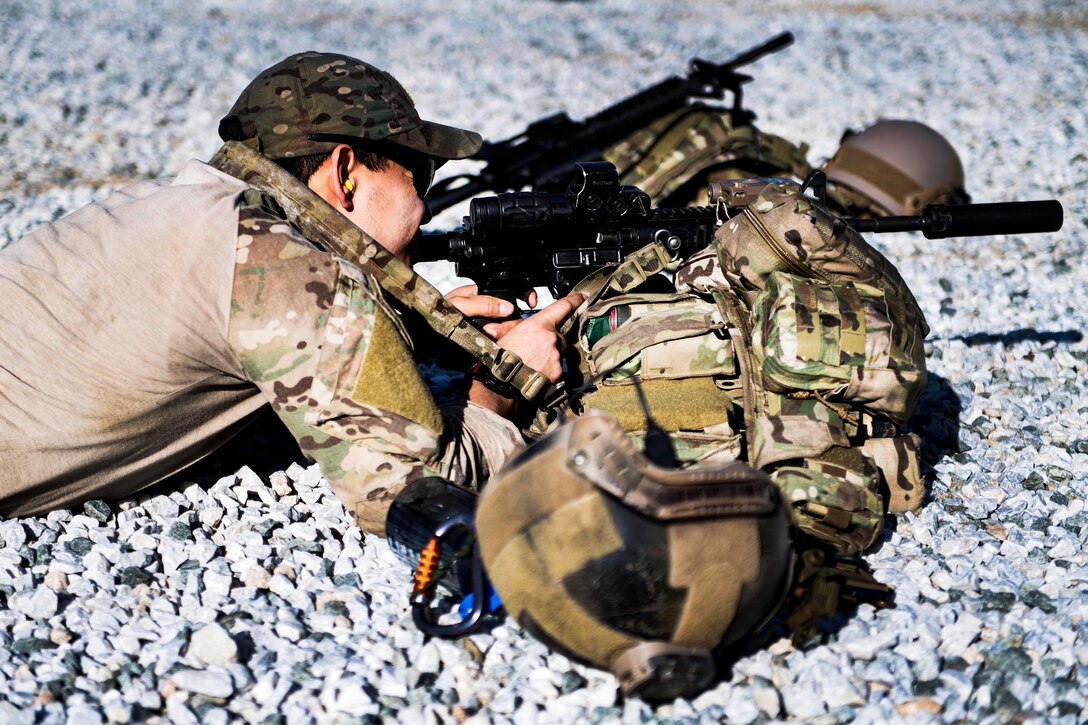 An Air Force pararescueman zeros his weapon before conducting weapons training.