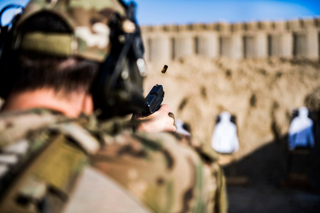 An Air Force pararescueman fires his Glock 9mm handgun during weapons training.