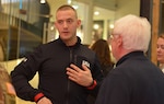 Sgt. Justin Olsen, shown speaking to media at a press event in Baltimore last month, is competing in his third Olympic Games.