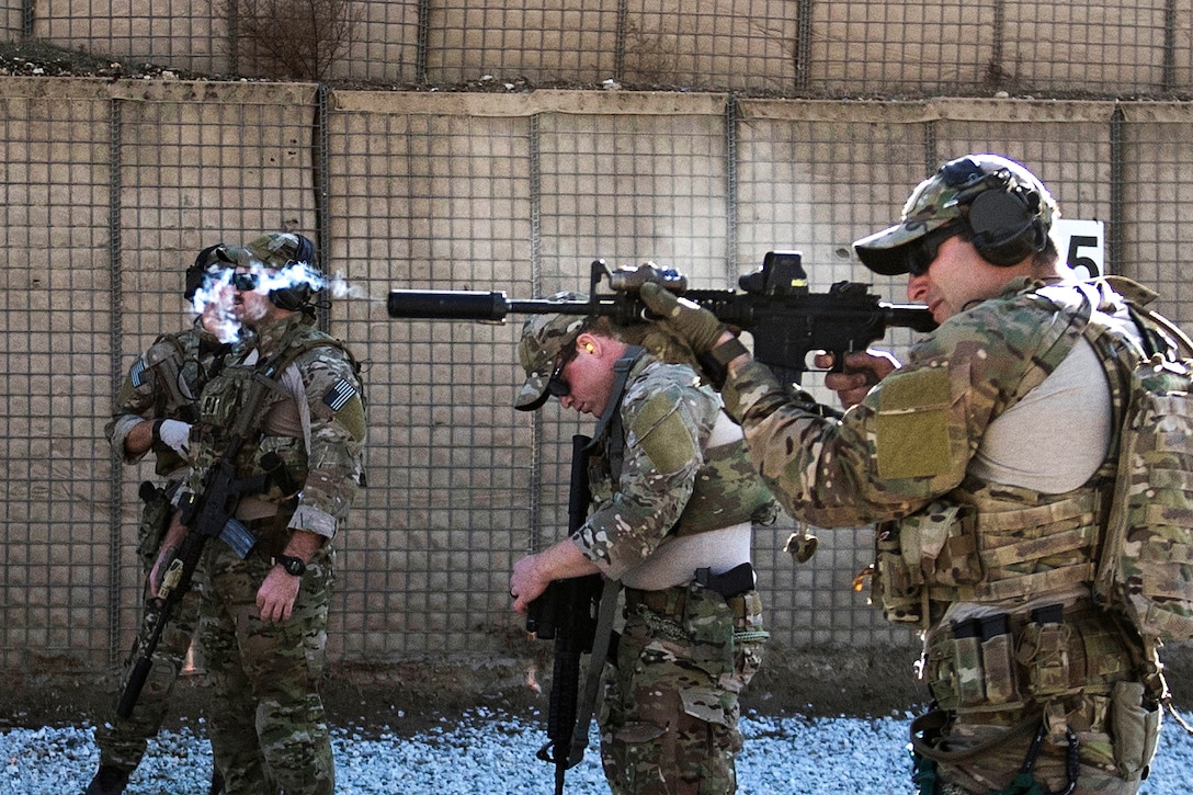 Air Force airmen participate in close range rifle training.