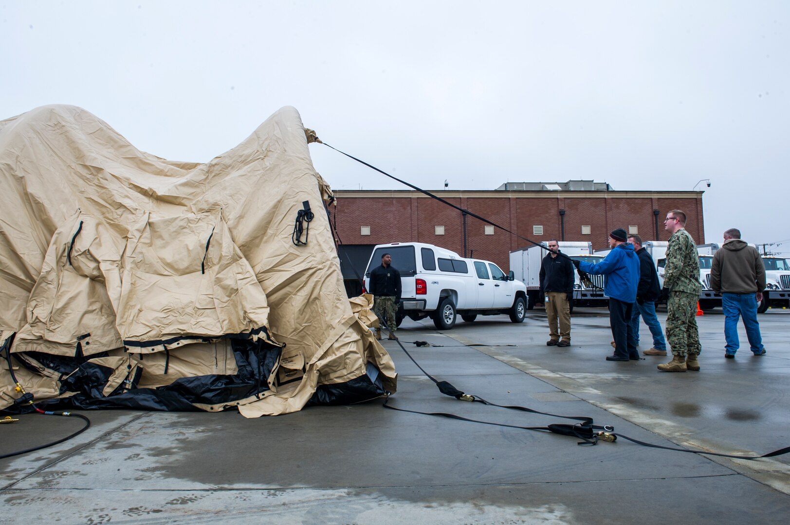 Members of Joint Task Force Civil Support set up a new tent during a tent exercise.