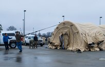 Members of Joint Task Force Civil Support set up a new tent during a tent exercise.