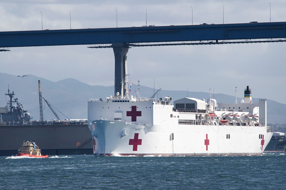 The Hospital ship USNS Mercy transits the San Diego Bay after departing Naval Base San Diego.