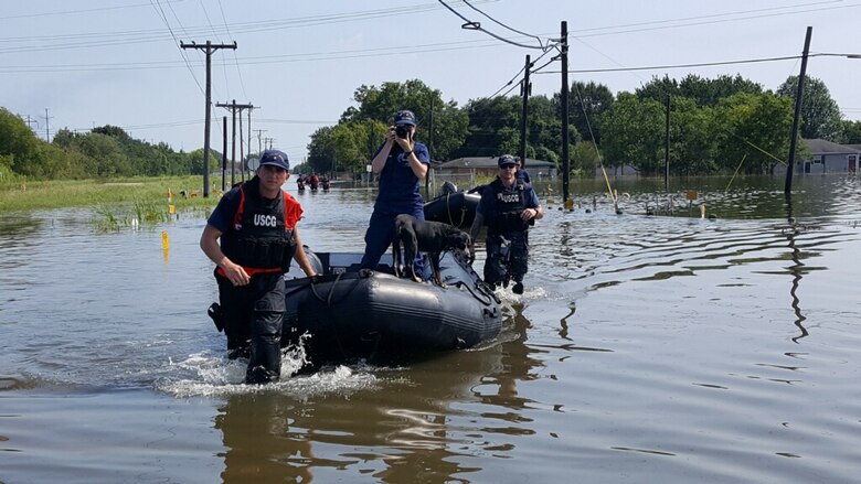 Valerie W. Higdon (center), Portland District program analyst and U.S. Coast Guard Reserve public affairs specialist: