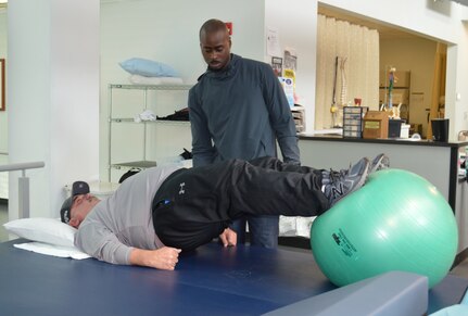 David Colbath, a victim of the Sutherland Springs shooting, works with physical therapist Oluwasegun Olomojobi Feb. 2, 2018 at the Center for the Intrepid at Joint Base San Antonio-Fort Sam Houston. The CFI team is using a combination of therapeutic exercises including high-intensity interval training, strengthening, cardio and balance to help Colbath return to his previous level of functioning.