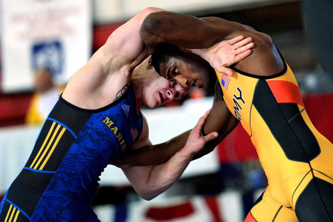 Marine Corp Sgt. Raymond Bunker, left, wrestles Army Spc. Ellis Coleman in the 72 kg weight class during the 2018 Armed Forces Wrestling Championship Greco-Roman competition.