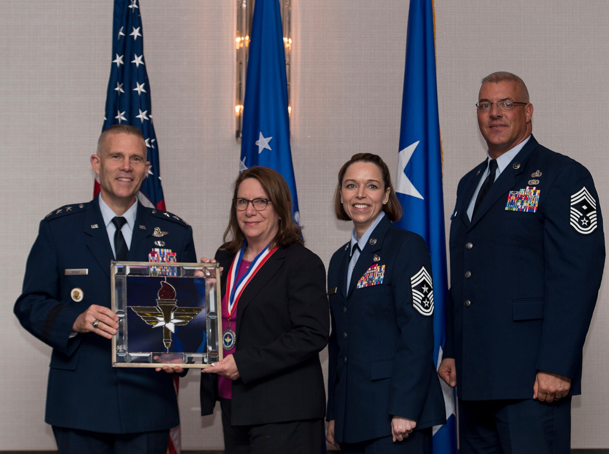 Brenda S. Sizemore, Director of Business Operations for the 17th Contracting Squadron at Goodfellow Air Force Base, Texas, receives the 2017 Supervisory Civilian of the Year Award from Lt. Gen. Steve Kwast, Commander of AETC, during the AETC 12 Outstanding Airmen of the Year Awards banquet Feb. 22, 2018 in Orlando, Fla. Sizemore earned Best AETC Contracting Civilian two years in a row, led AETC’s best base-level cost reduction program, saving the Air Force $13 million over six years, as well as managed the Contracting Officer Warrant Program, helping to alleviate squadron buy shortfall while also increasing contract award production by 27 percent. (U.S. Air Force photo by Staff Sgt. Kenneth W. Norman)
