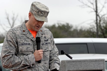 Chaplain (Maj.) Craig Forsythe, 67th Cyberspace Wing, provides the invocation during a ribbon-cutting ceremony in San Antonio, Texas, Feb. 23, 2018. The ceremony was held to mark the opening of a new 67th CW offensive cyberspace operations training location for cyberspace operators. (U.S. Air Force photo by Tech. Sgt. R.J. Biermann)