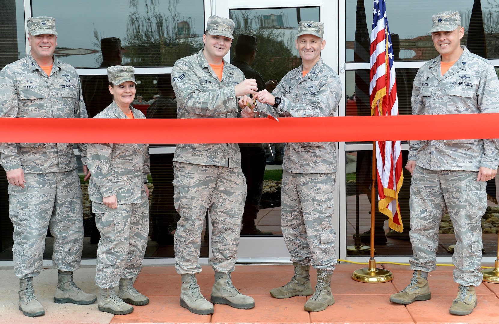 67th Cyberspace Wing leaders cut the ribbon to mark the opening of a new offensive cyberspace operations training location in San Antonio, Texas, Feb. 23, 2018. Cyberspace operators will receive centralized and standardized training at the new location, which aims to host its first class in March 2018. (U.S. Air Force photo by Tech. Sgt. R.J. Biermann)