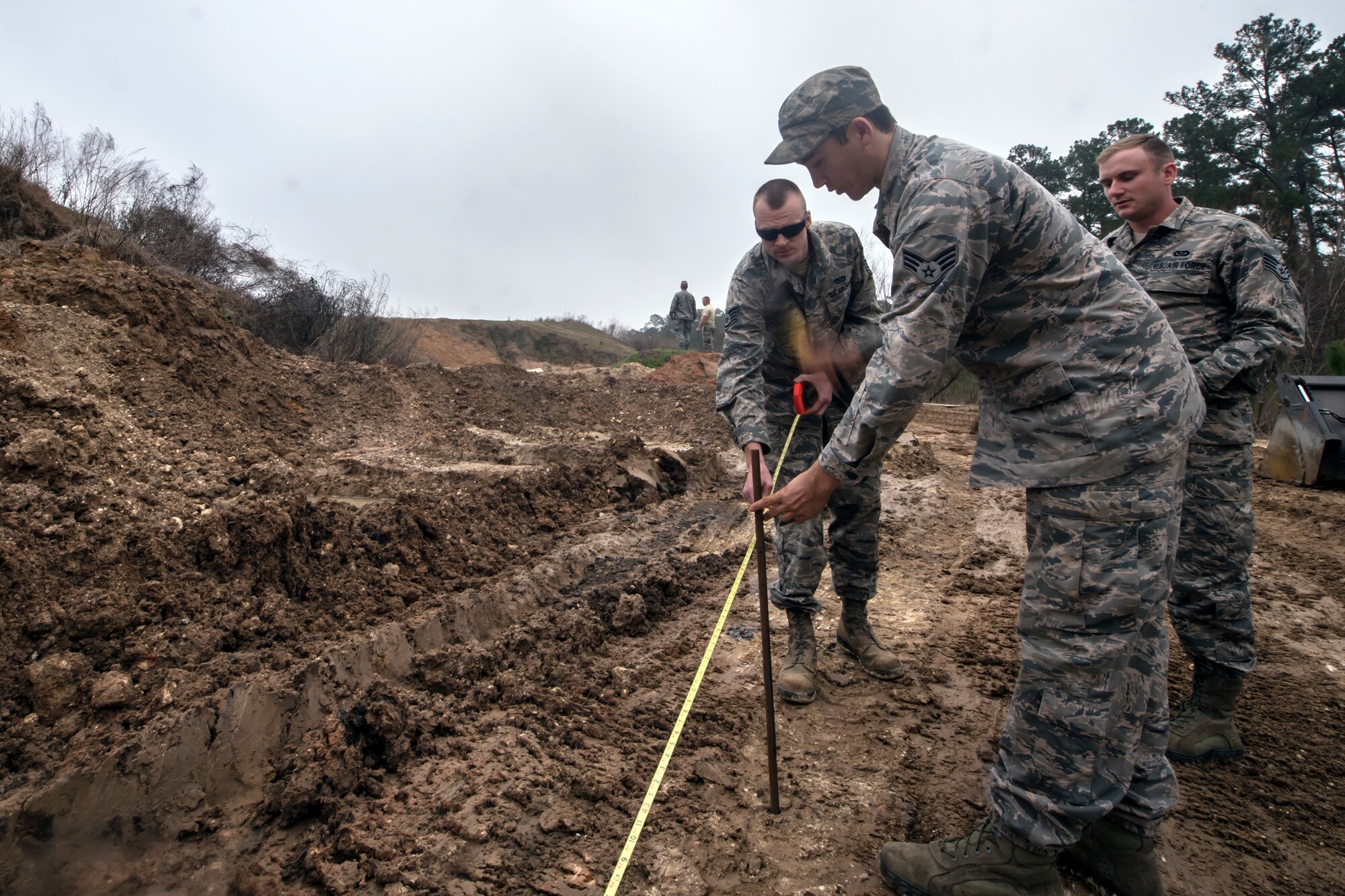 Airmen from the 23d Civil Engineer Squadron mark a perimeter, Feb. 15, 2018, at Moody Air Force Base, Ga. Airmen from the 23d CES participated in a Prime Base Engineer Emergency Force training day to prepare for some of the wartime tasks they could encounter while in a deployed environment. (U.S. Air Force photo by Airman Eugene Oliver)