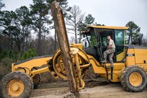 Airman 1st Class Brendan Brown, 23d Civil Engineer Squadron horizontal construction engineer, observes the blade of a grader, Feb. 15, 2018, at Moody Air Force Base, Ga. Airmen from the 23d CES participated in a Prime Base Engineer Emergency Force training day to prepare for some of the wartime tasks they could encounter while in a deployed environment. (U.S. Air Force photo by Airman Eugene Oliver)