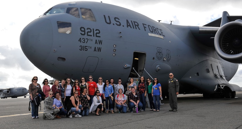 Key spouse appreciation flight attendees pose in front of a C-17 Globemaster III Feb. 24, 2017 at Joint Base Charleston, S.C.